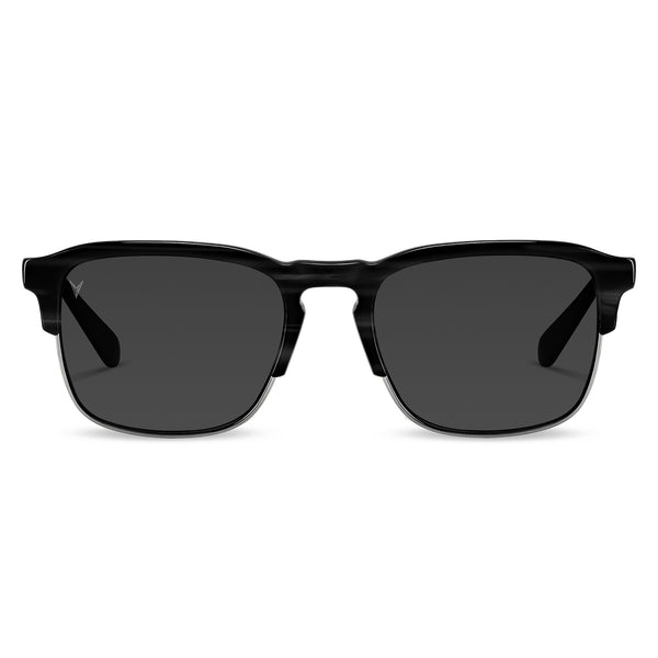 A pair of black sunglasses with a smoky gray lens, featuring premium acetate frames with marble accents and stainless steel hardware.