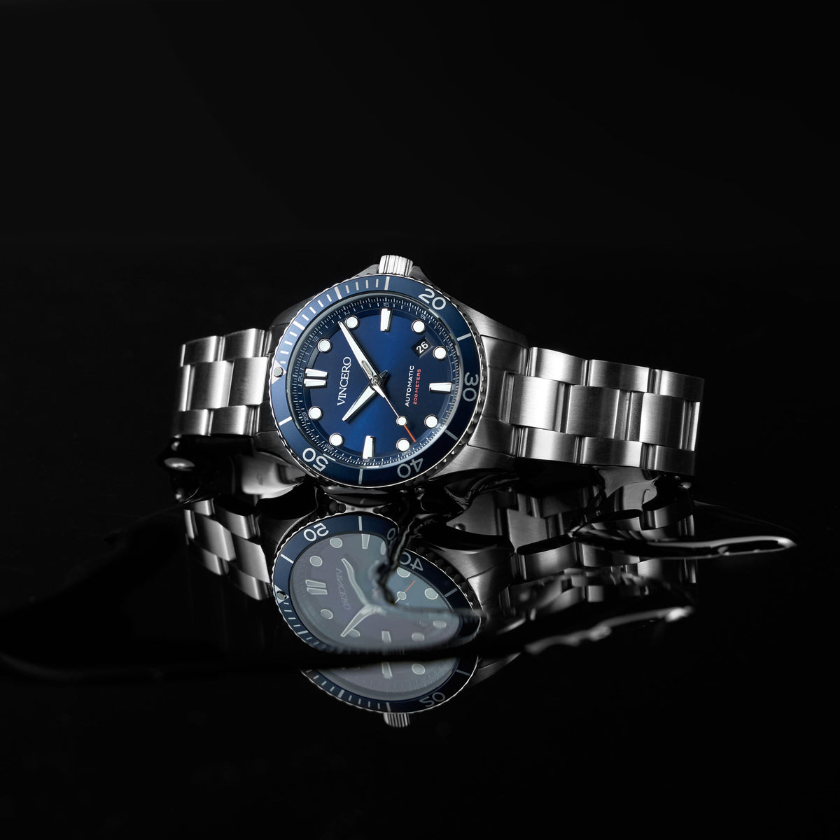 Silver watch with blue dial on a black background