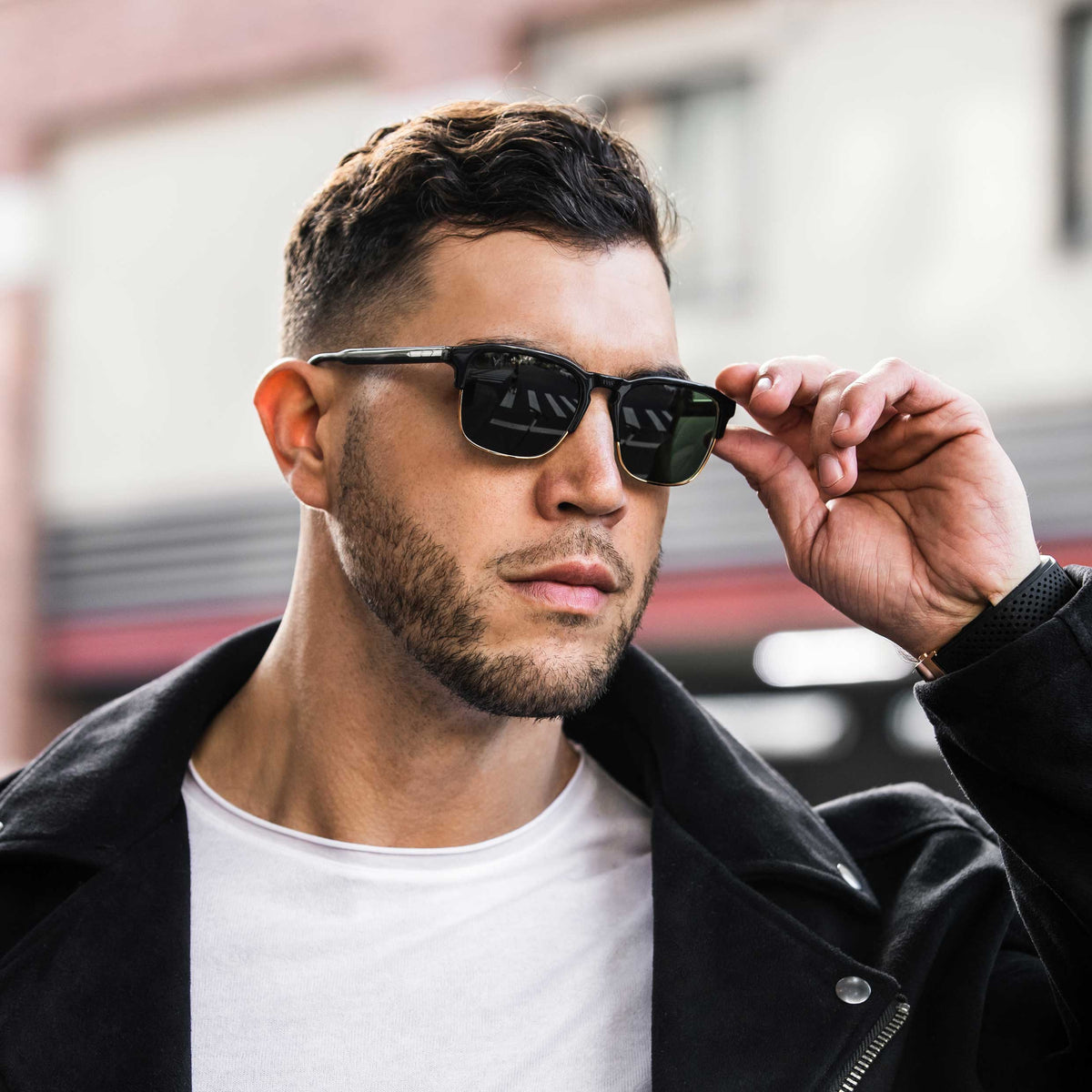 Man wearing sunglasses with a blurred background