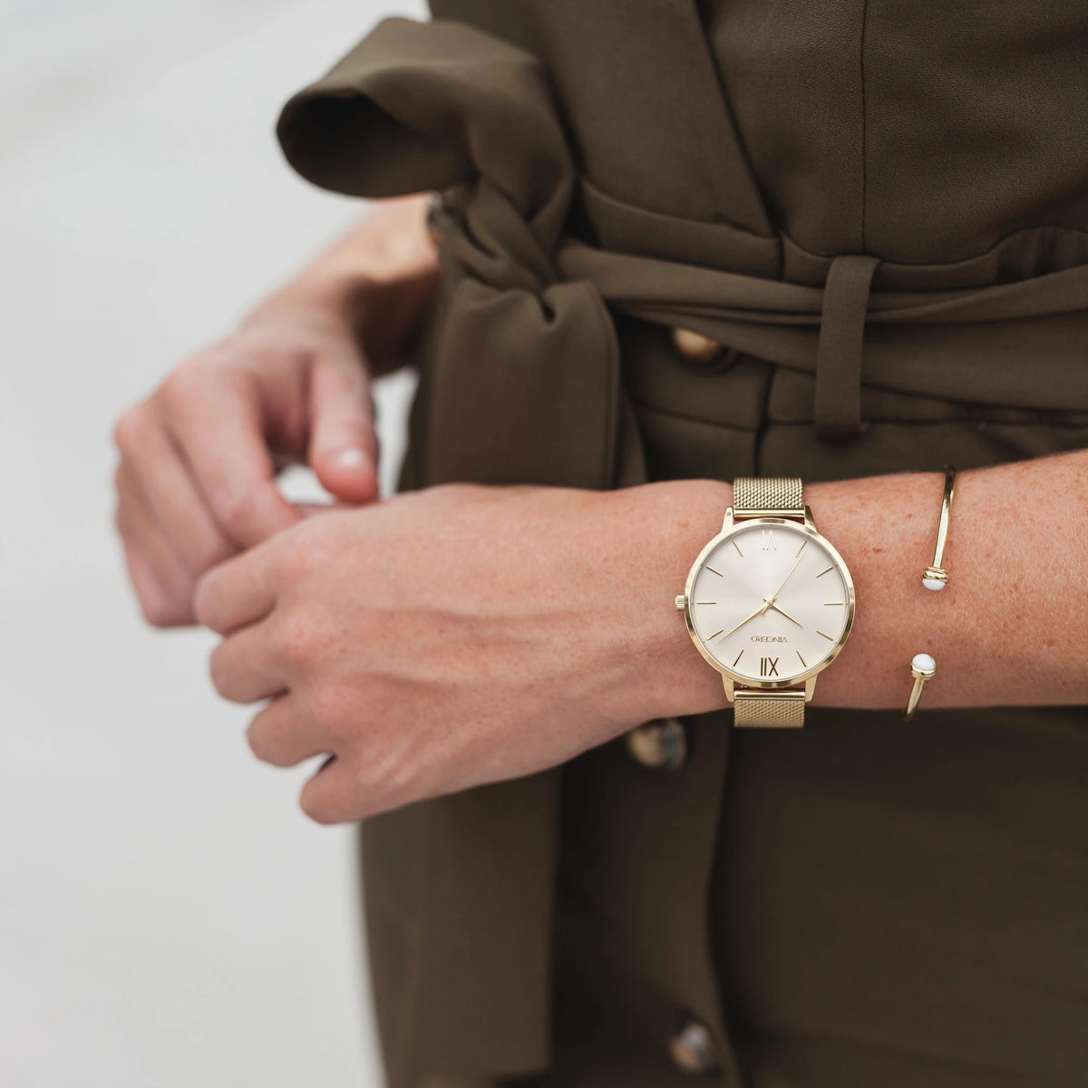 Eros on wrist gold watch