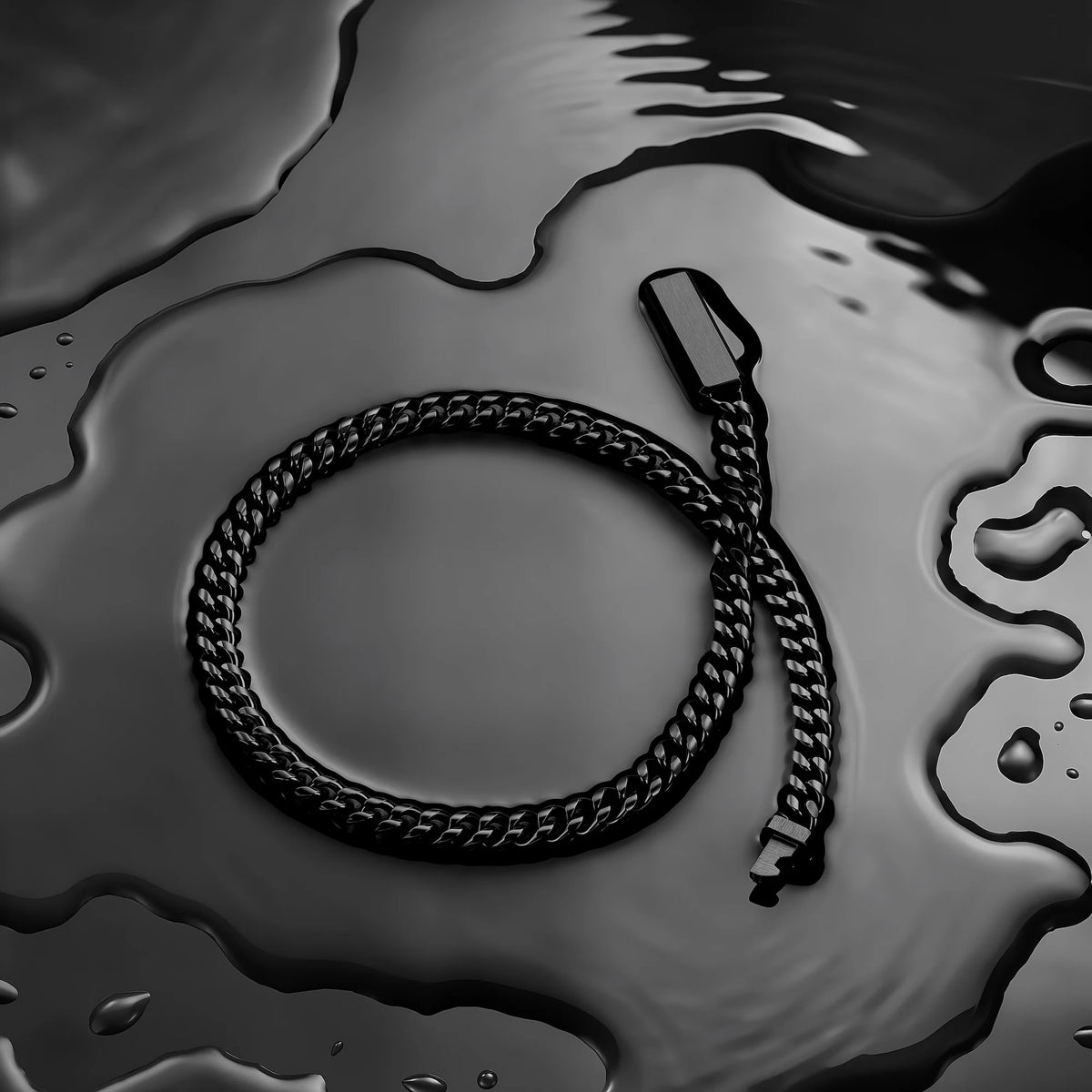 A black braided chain accessory, likely a necklace or strap, arranged in a loop on a glossy, wet dark surface with water droplets.