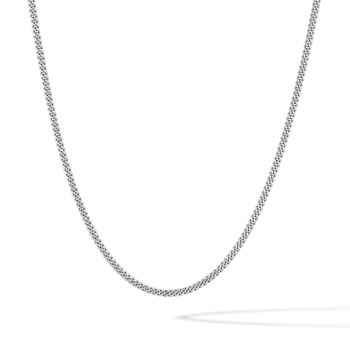 A silver-toned chain necklace with a textured, woven link design, shown draped in a U-shape against a clean white background.