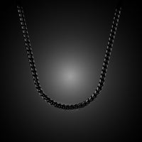 Black chain necklace on a dark background