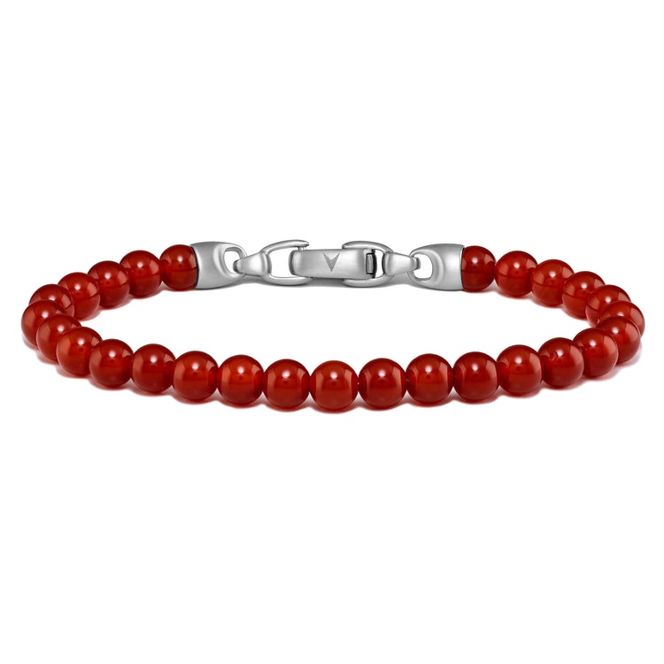 Red beaded bracelet with a silver clasp on a white background