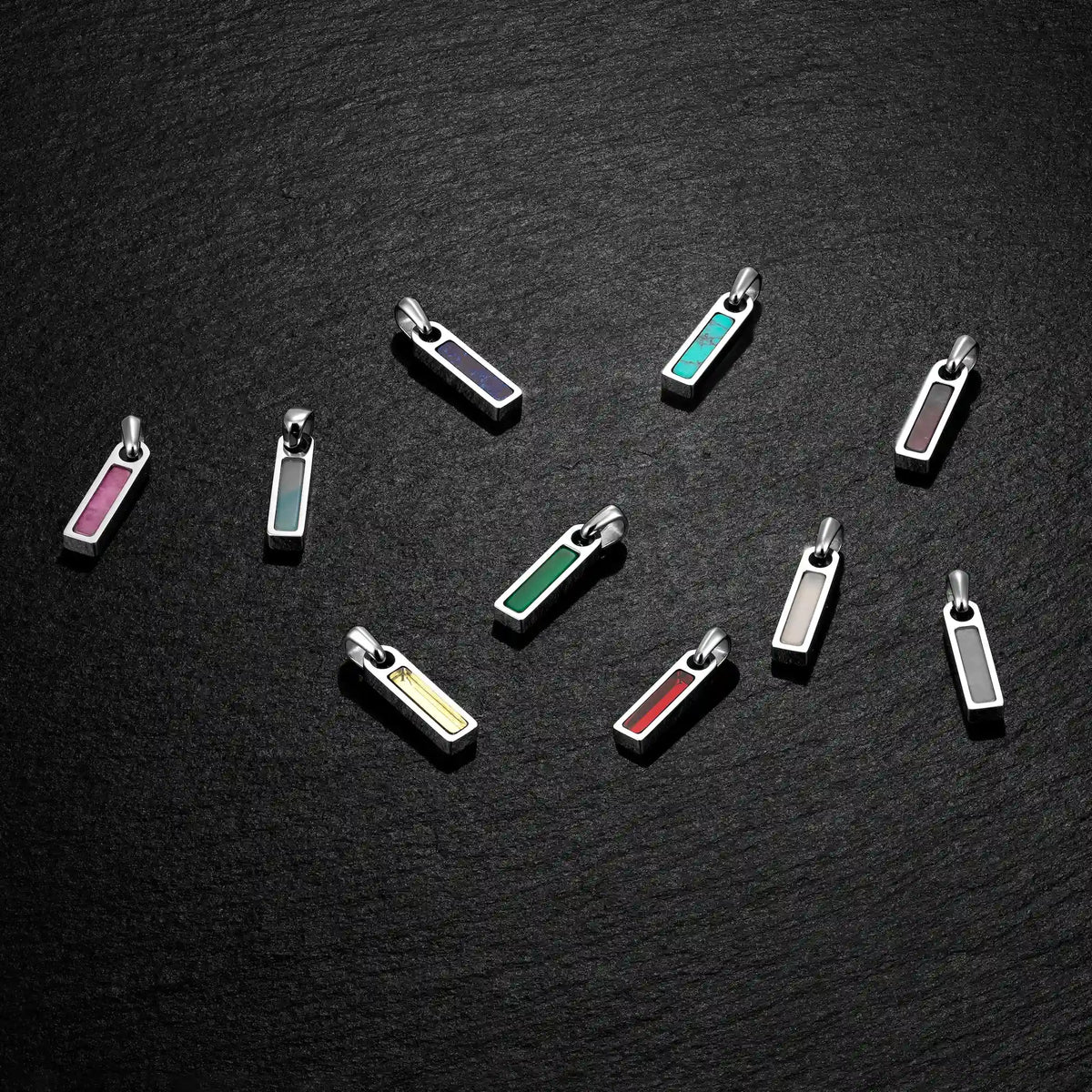mens birthstone pendants on black
