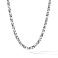 A silver-toned metal chain necklace with a curb link pattern, shown draped in a U-shape against a clean white background.