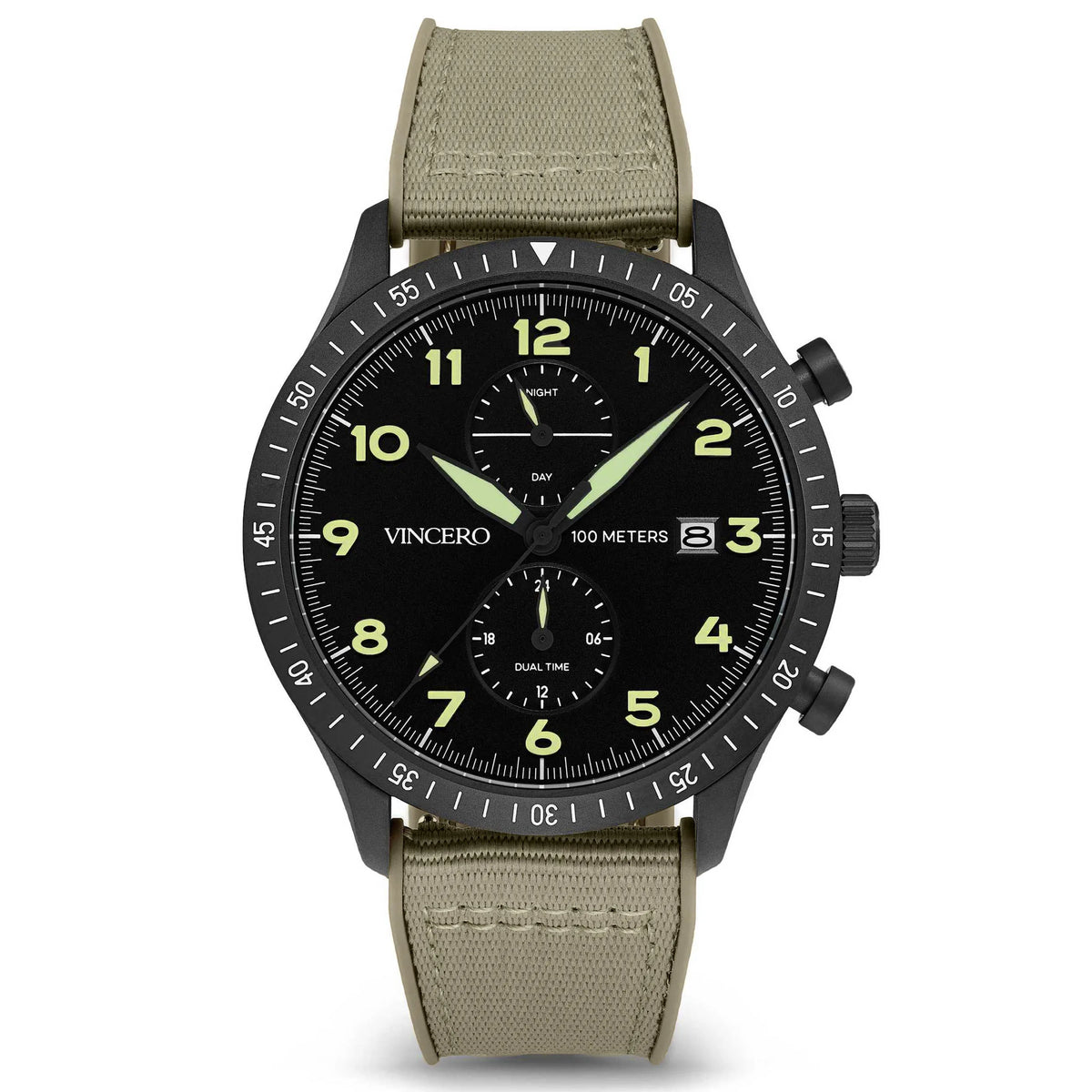 A black analog watch with a graphite case, black dial with luminous hands and indices, and a green fabric strap. The watch has a chronograph feature and displays time, date, and dual time zones.