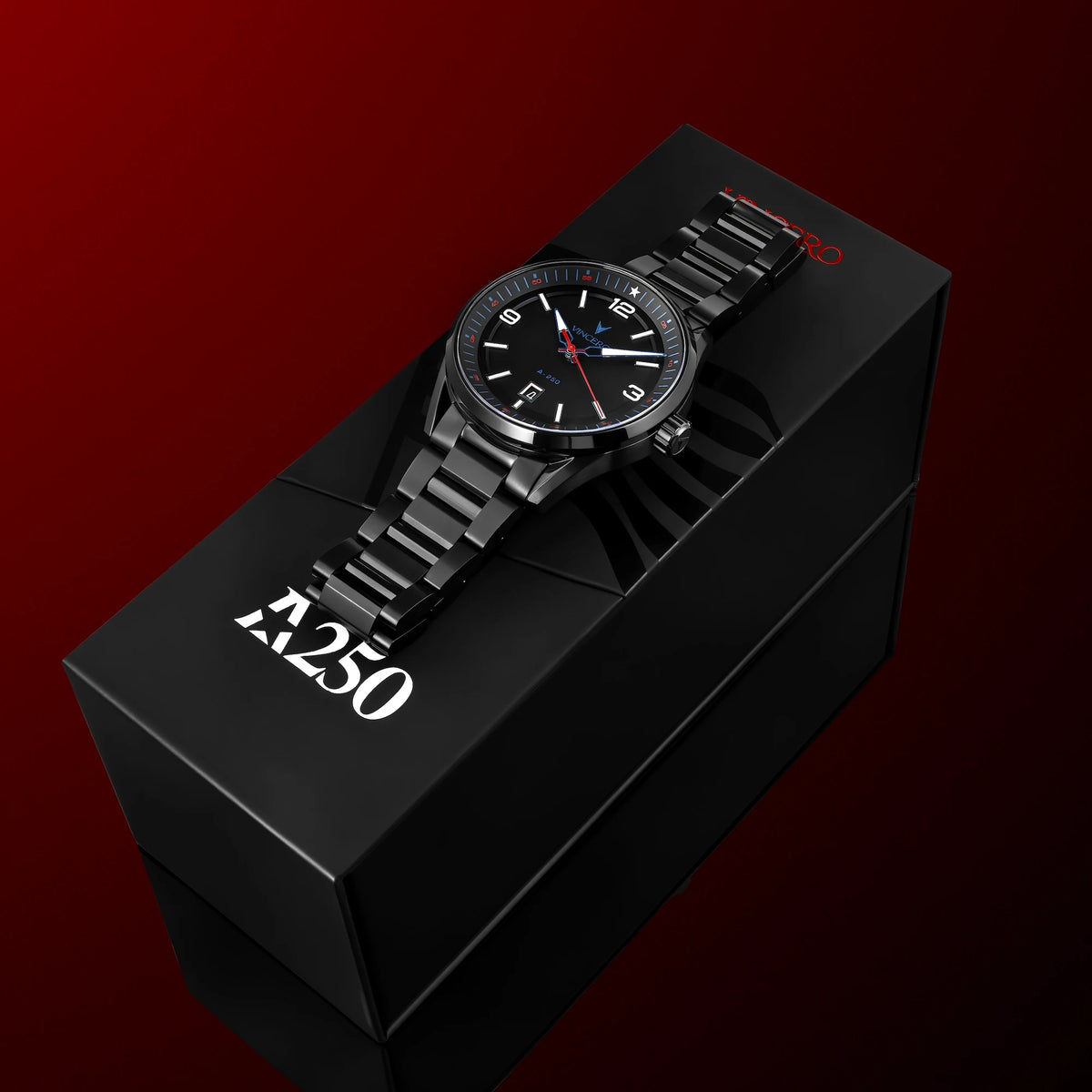 A black analog watch with a metal link bracelet and black dial sits on top of a black branded box against a dark red gradient background. The box shows the brand name 'Z250' in white.