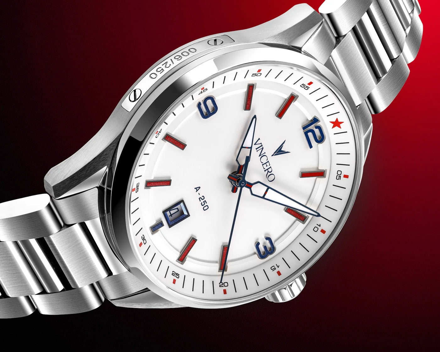 A close-up studio shot of a Vacheret & Sérvis watch with a silver stainless steel bracelet and case, featuring a white dial with red and blue accents, set against a dark red gradient background.