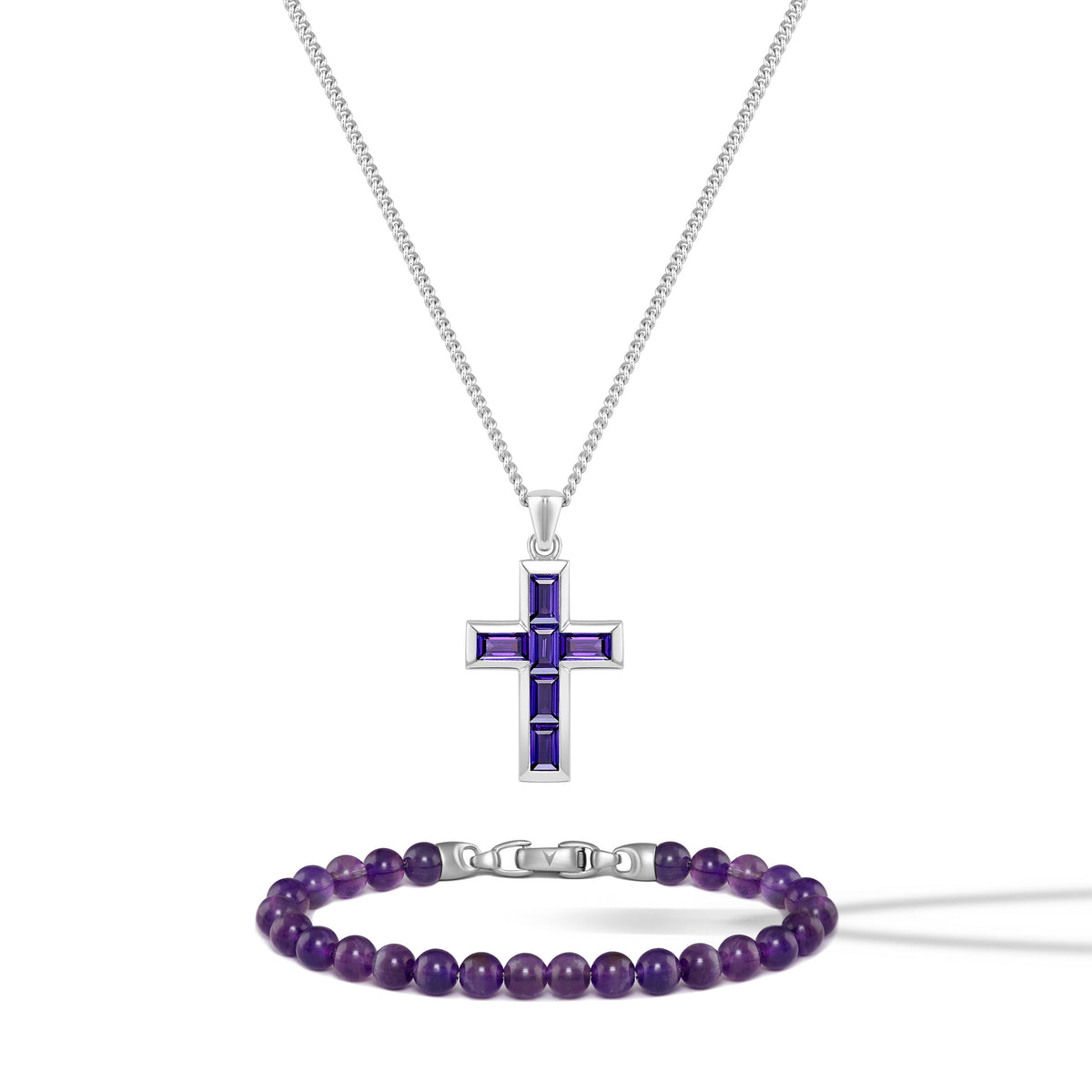 Silver cross pendant with purple accents and a matching bracelet on a white background