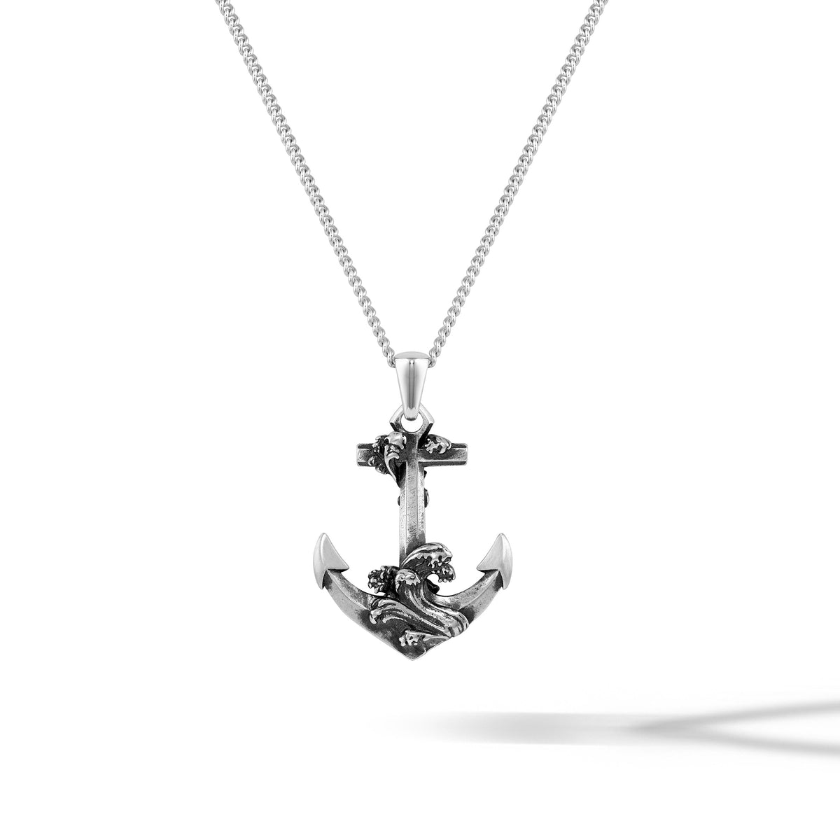Silver anchor pendant necklace on a white background