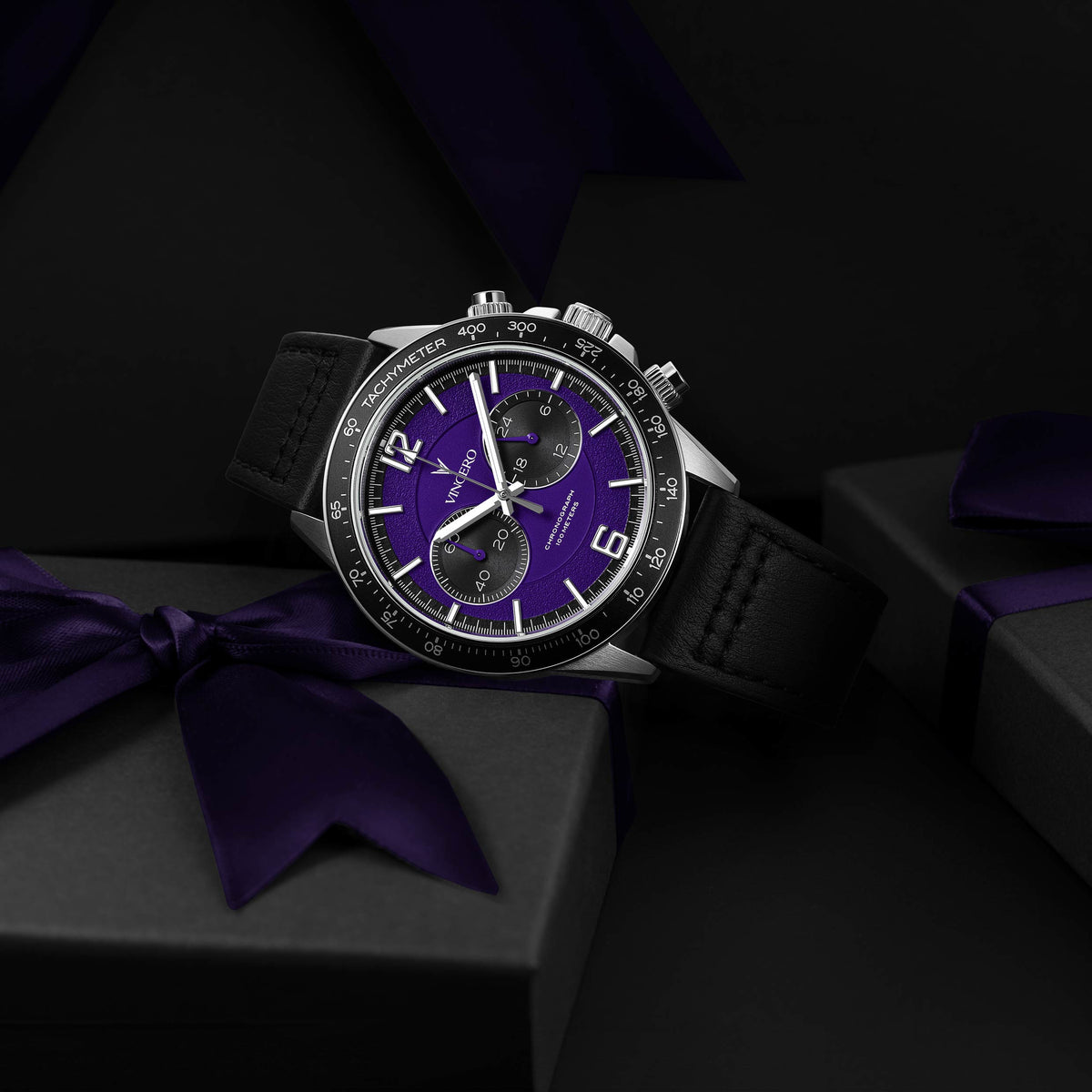 Apex Limited Edition watch, featuring a violet face, black and silver casing, and black band, displayed on its side.
