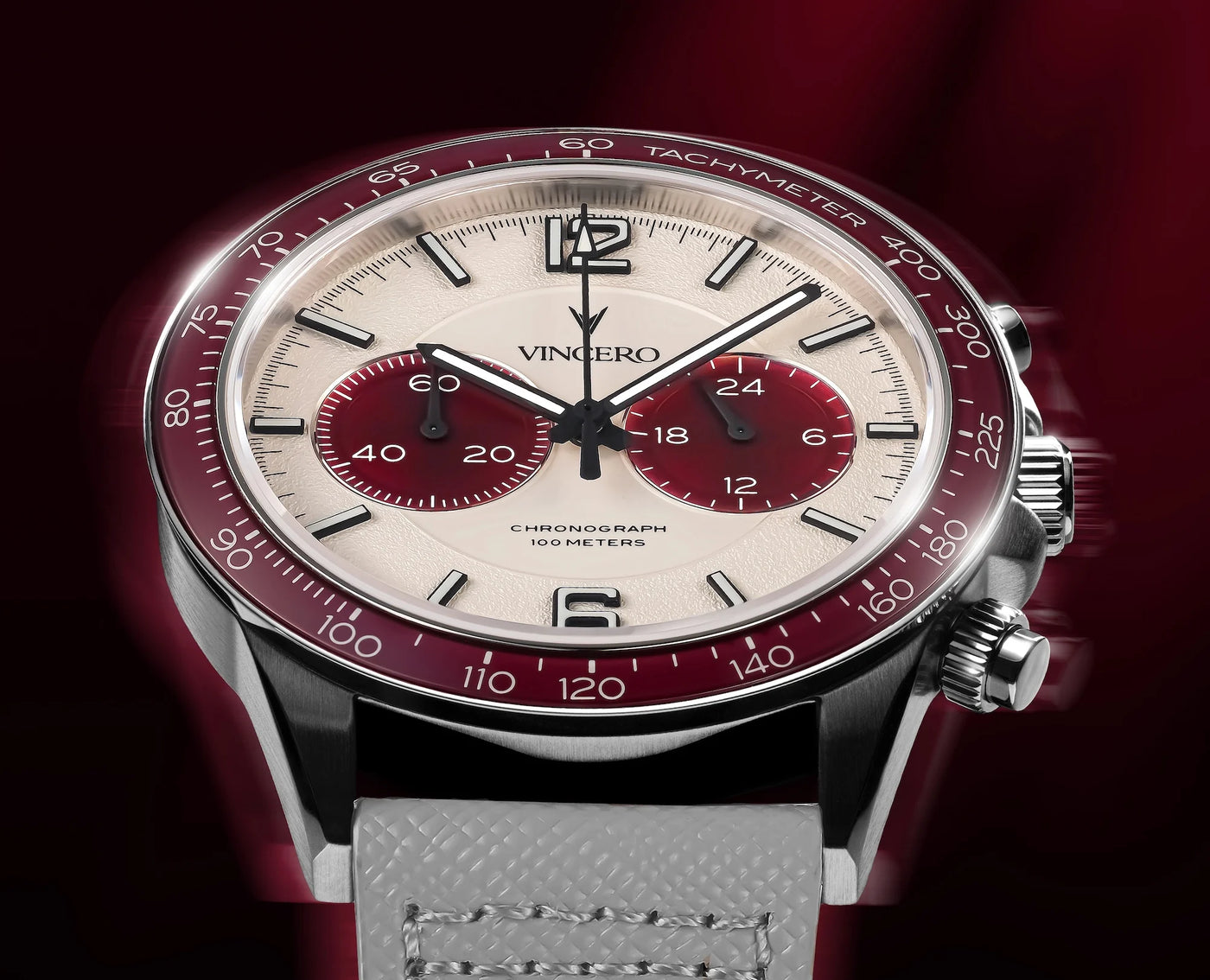 Luxury watch with red and silver design on a dark background