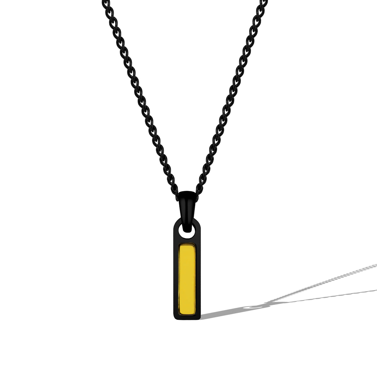 Necklace with a black chain and yellow pendant on a white background