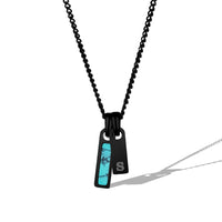 Black chain necklace with a unique pendant on a white background