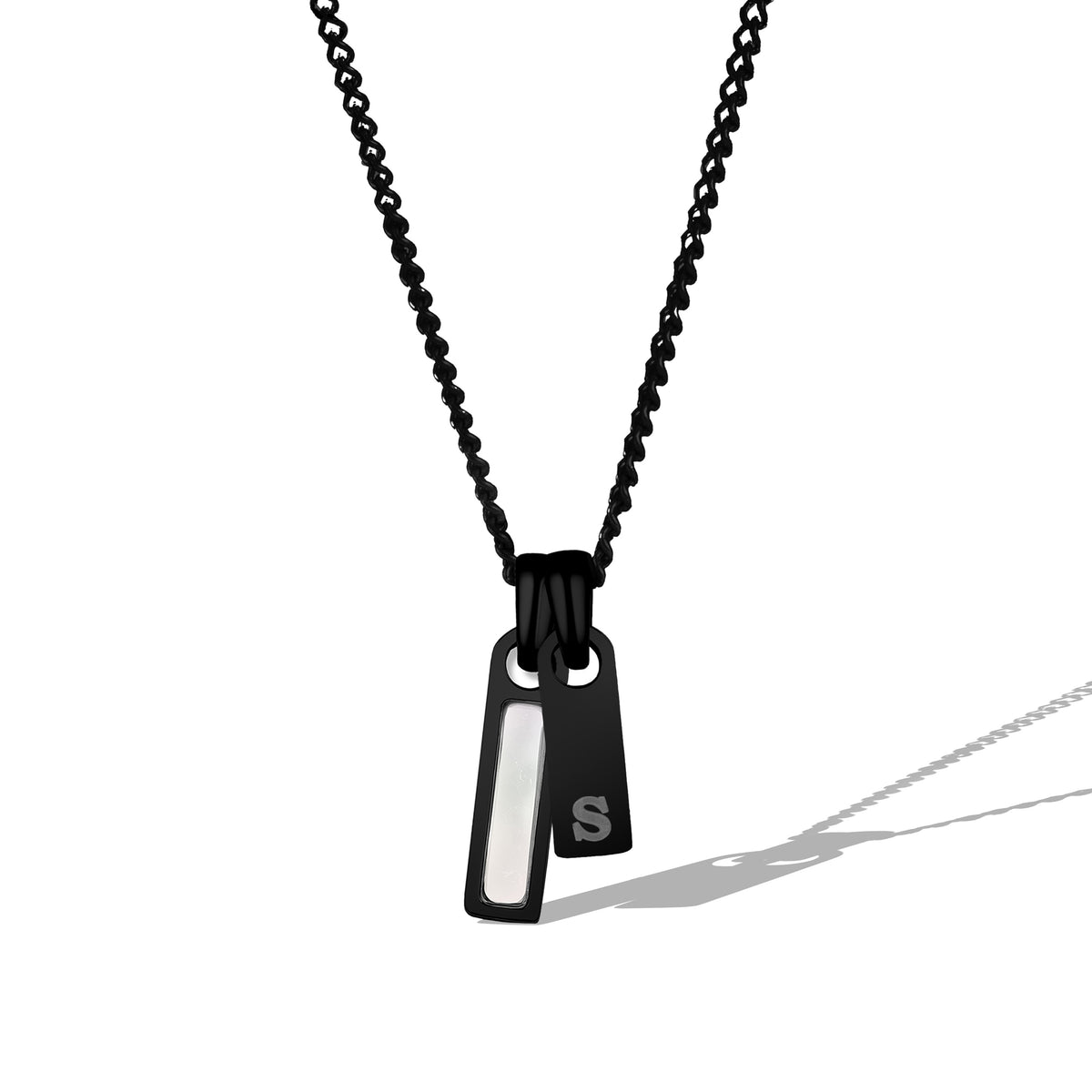 Black necklace with a pendant on a white background