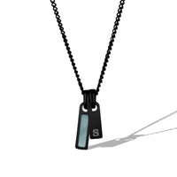 Black necklace with a pendant on a white background