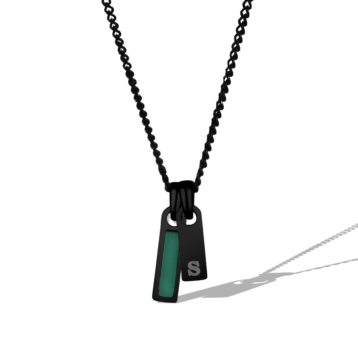 Black chain necklace with a pendant featuring a green accent on a white background