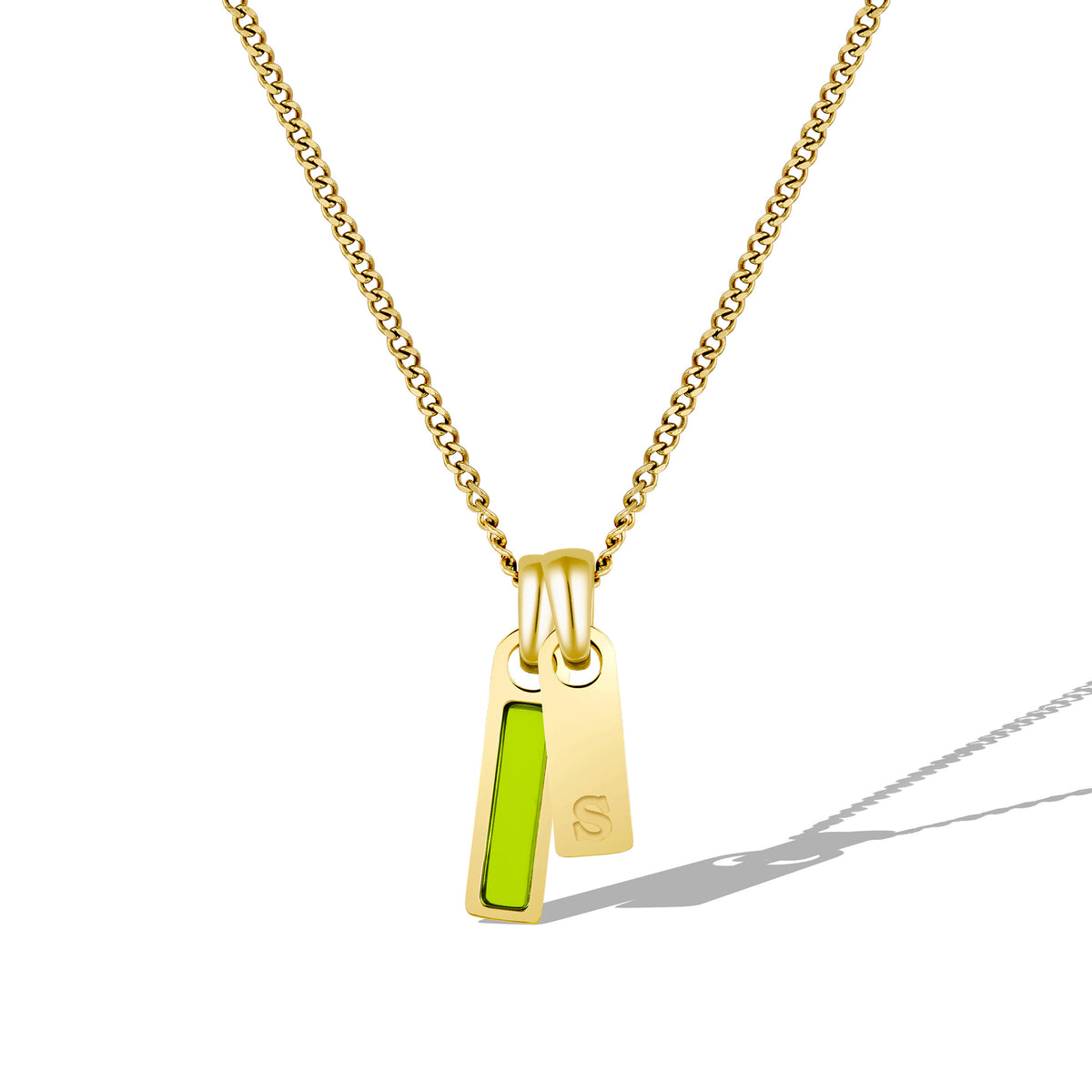 Gold necklace with a pendant featuring a green stone on a white background