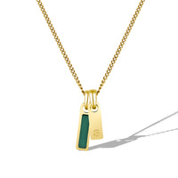 Gold necklace with a pendant featuring a green stone on a white background