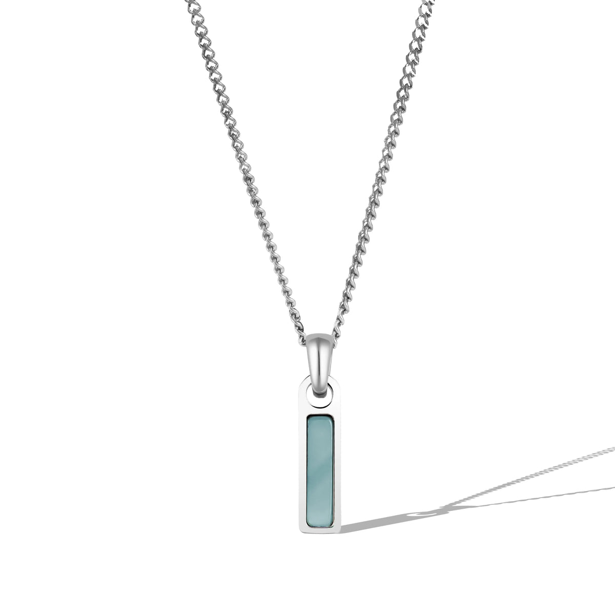 A silver necklace with a rectangular blue tag pendant attached to a chain.