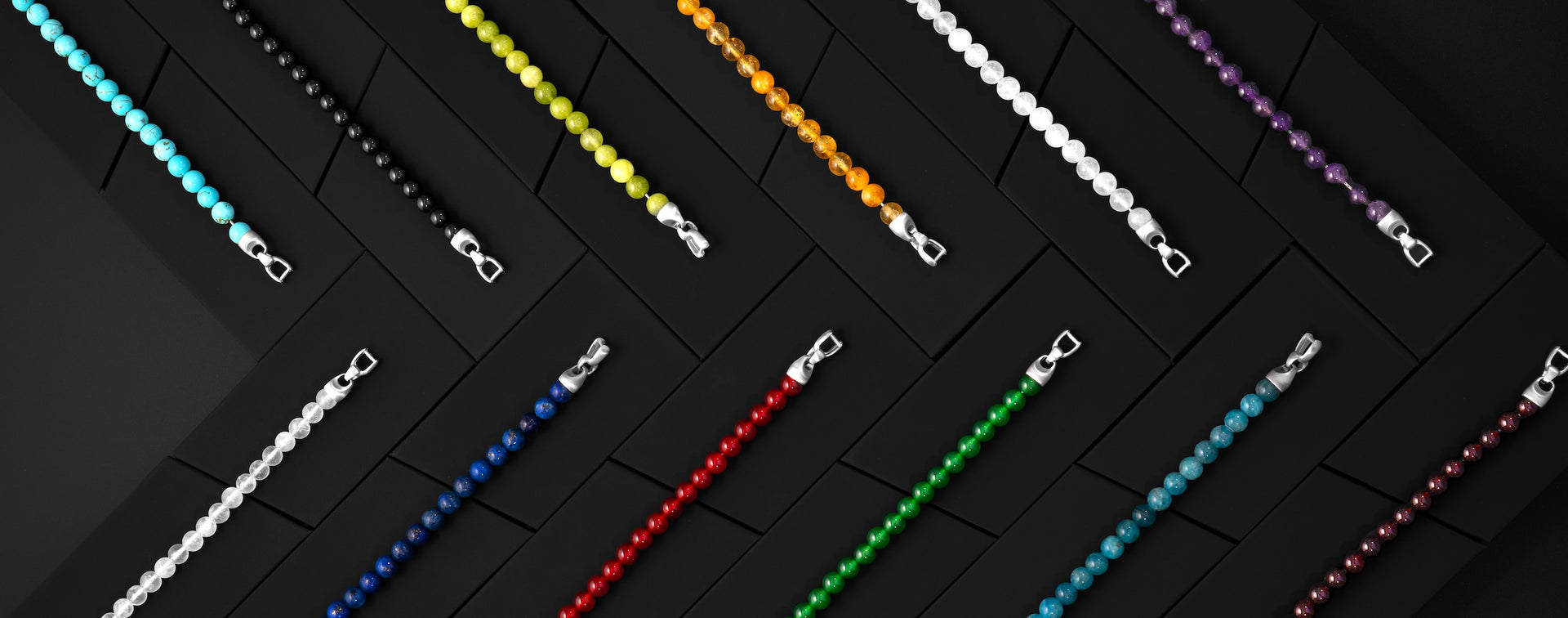 Colorful chain necklaces on a black background
