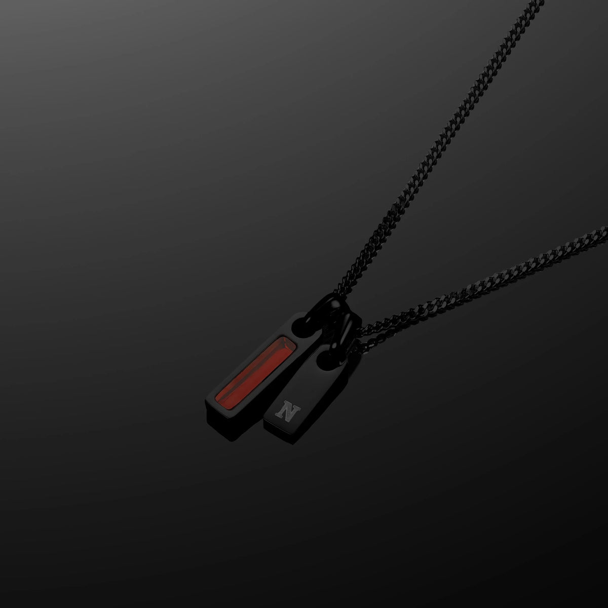 Black necklace with a pendant on a dark background