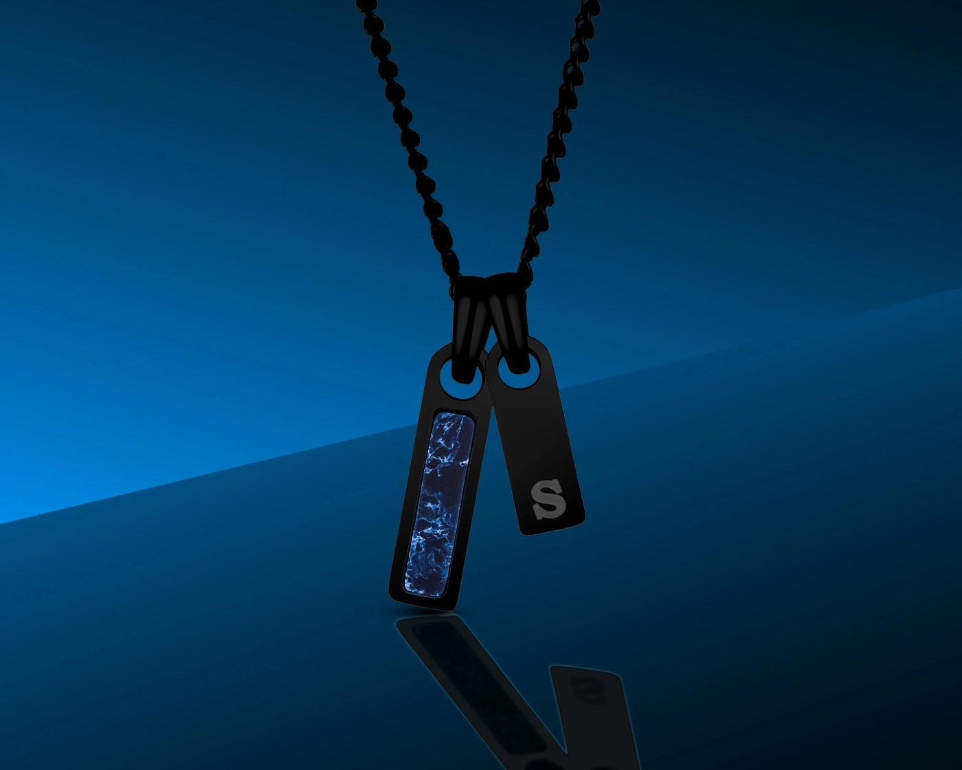 Black necklace with two tags on a blue gradient background
