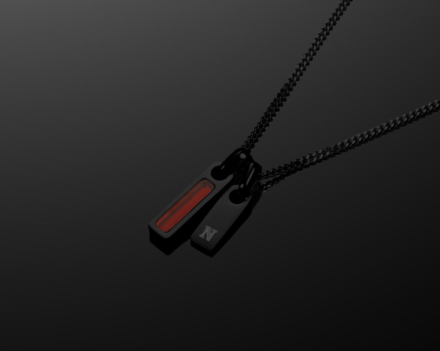 Black necklace with a pendant on a dark background
