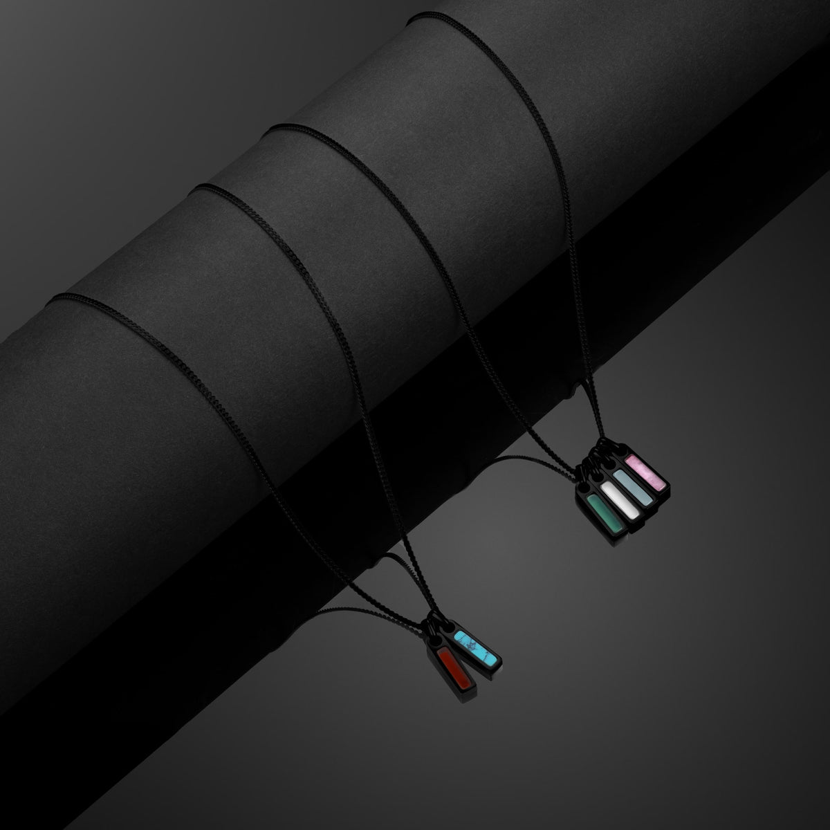 Necklace with colorful pendants on a dark background