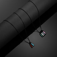 Necklace with colorful pendants on a dark background