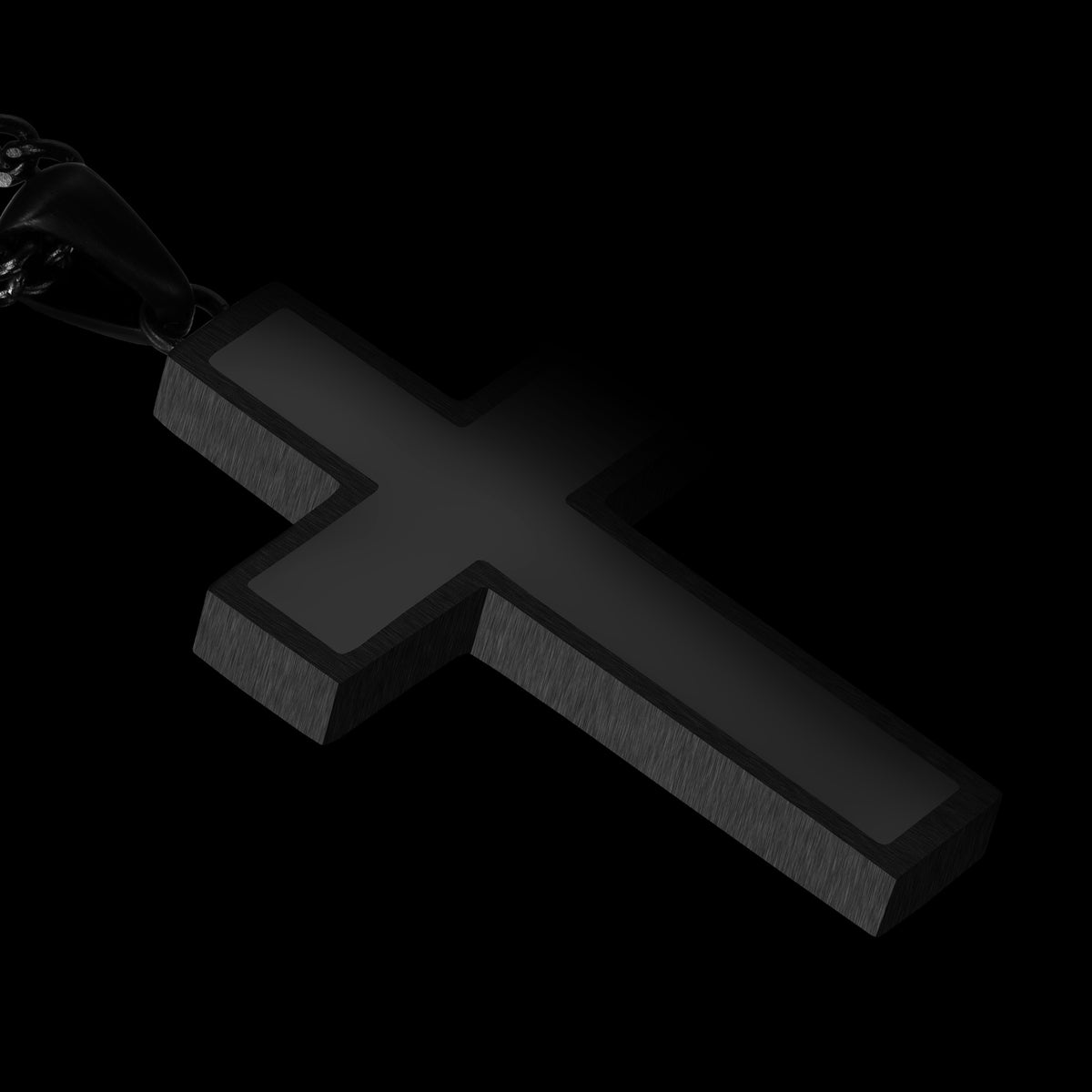 Close-up of a black cross pendant