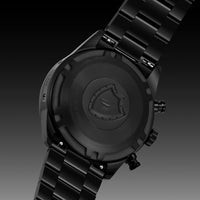 Black watch with brand logo on a dark background