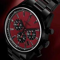 Black and red watch with 'Vincero' branding on a dark background