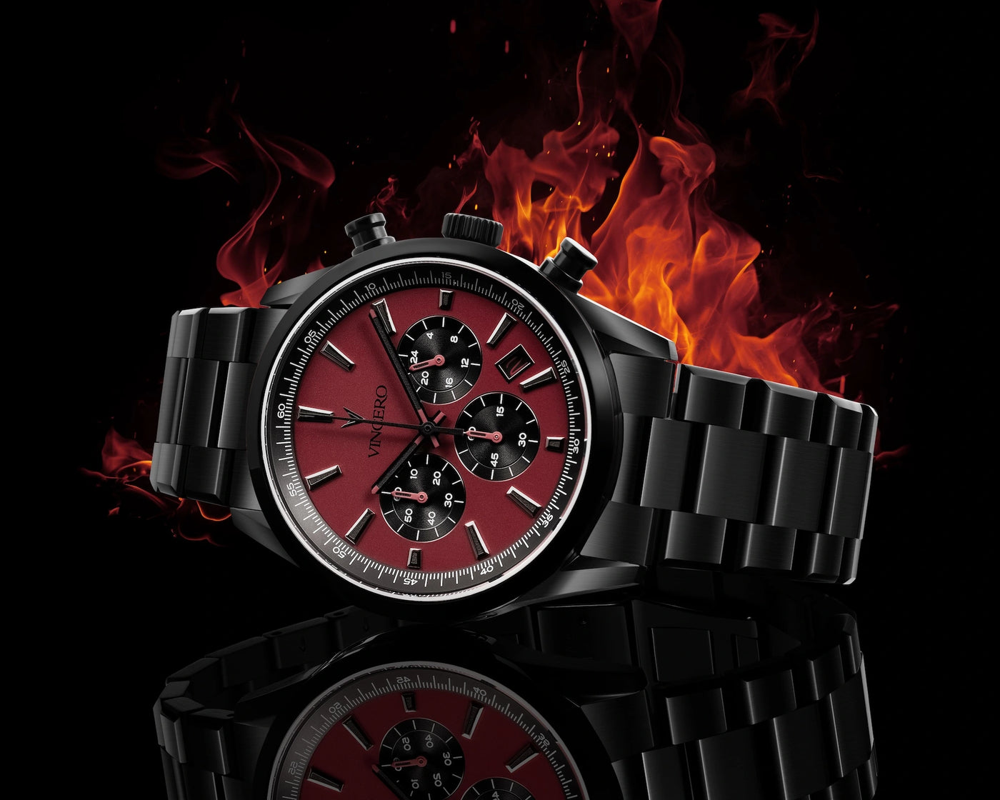 Black watch with red face on fire against a black background