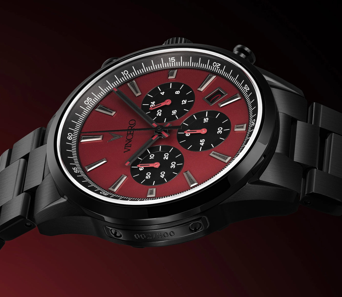 Watch with a red face and black strap on a dark background