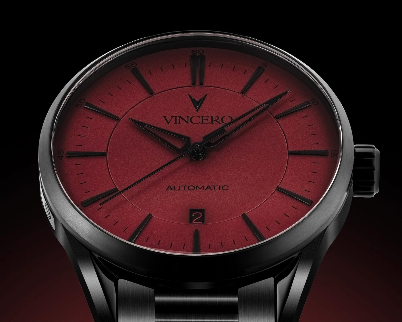 Watch with red face and black strap on a dark background