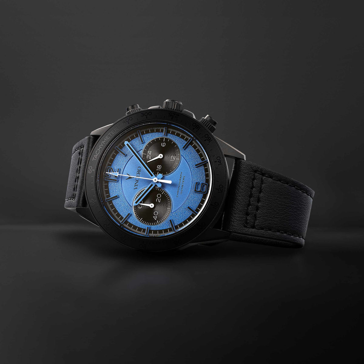 Apex Limited Edition watch, featuring a blue face and matte black band, displayed on its side. 