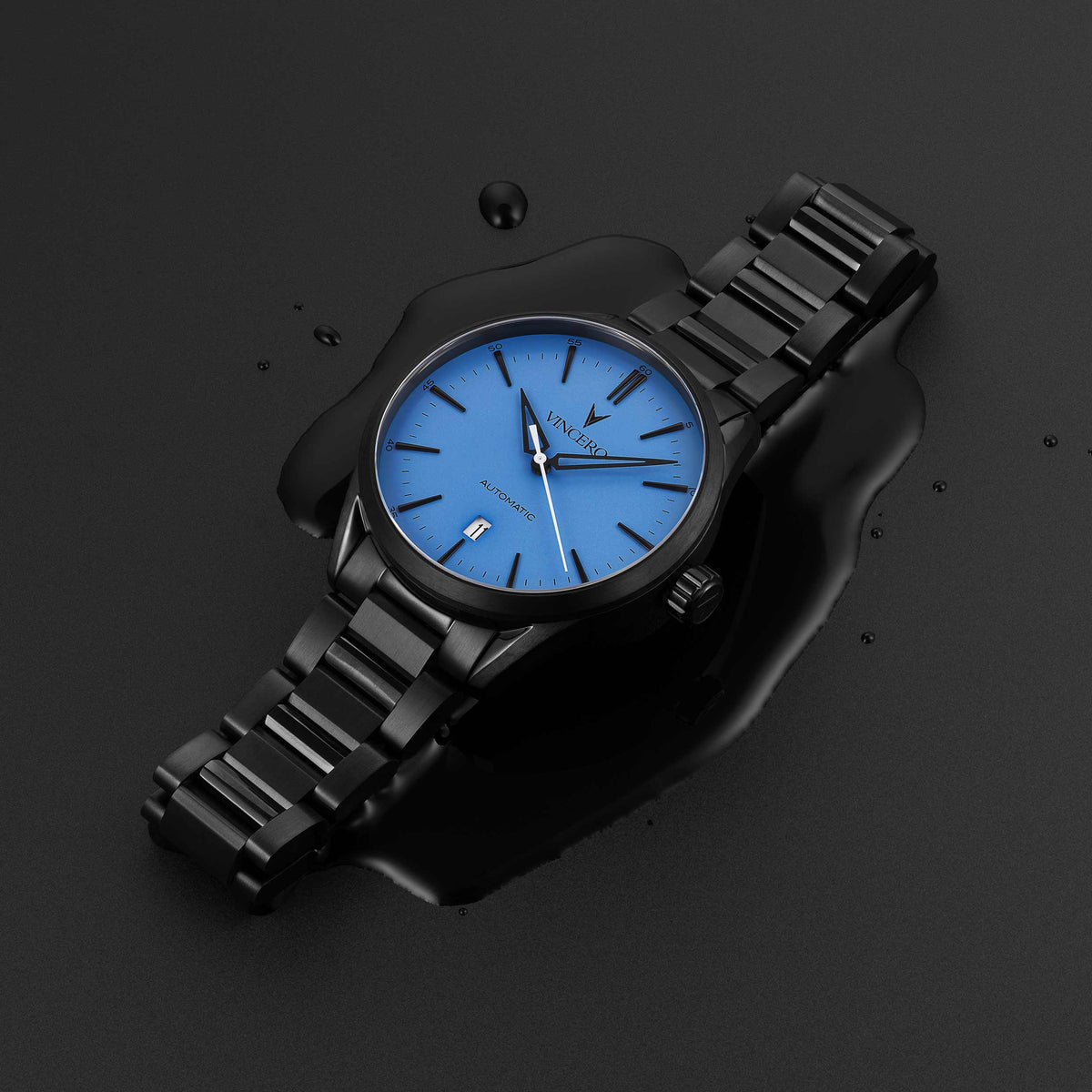 Icon Automatic watch, featuring a blue face and matte black band.