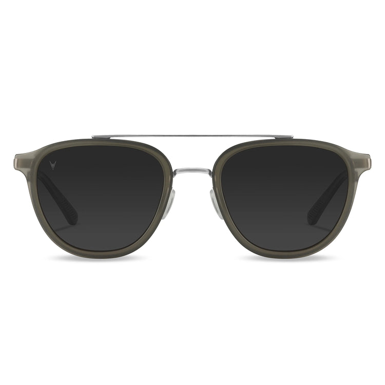 A pair of round full frame sunglasses with a metal bridge and acetate temples, in a gray color.