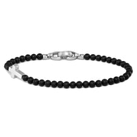 Black beaded bracelet with a silver clasp on a white background