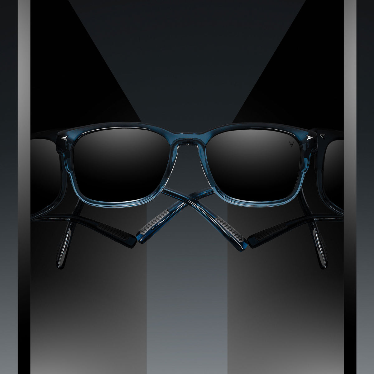Blue sunglasses with dark lenses on a reflective black surface