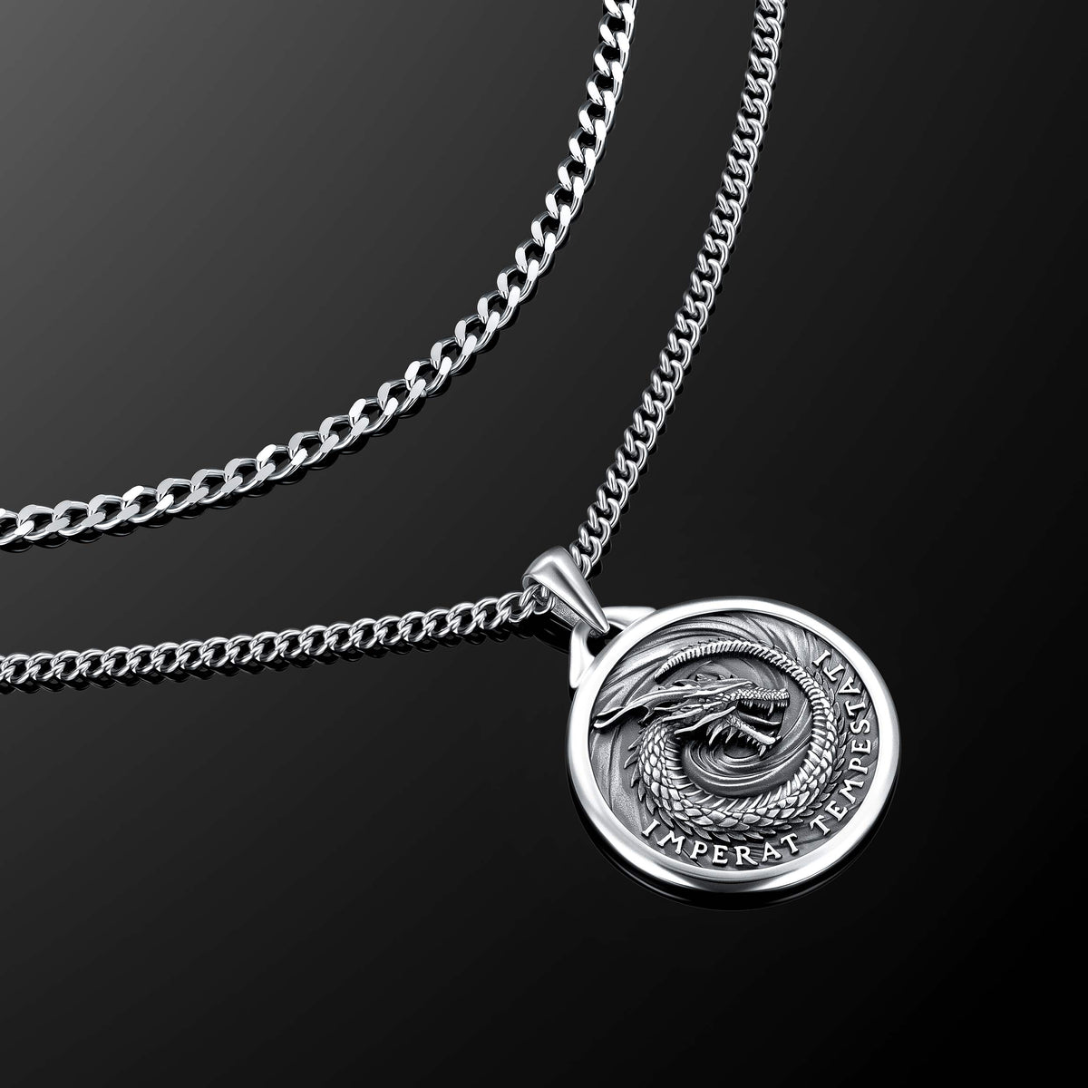 Silver necklace with a round pendant on a black background