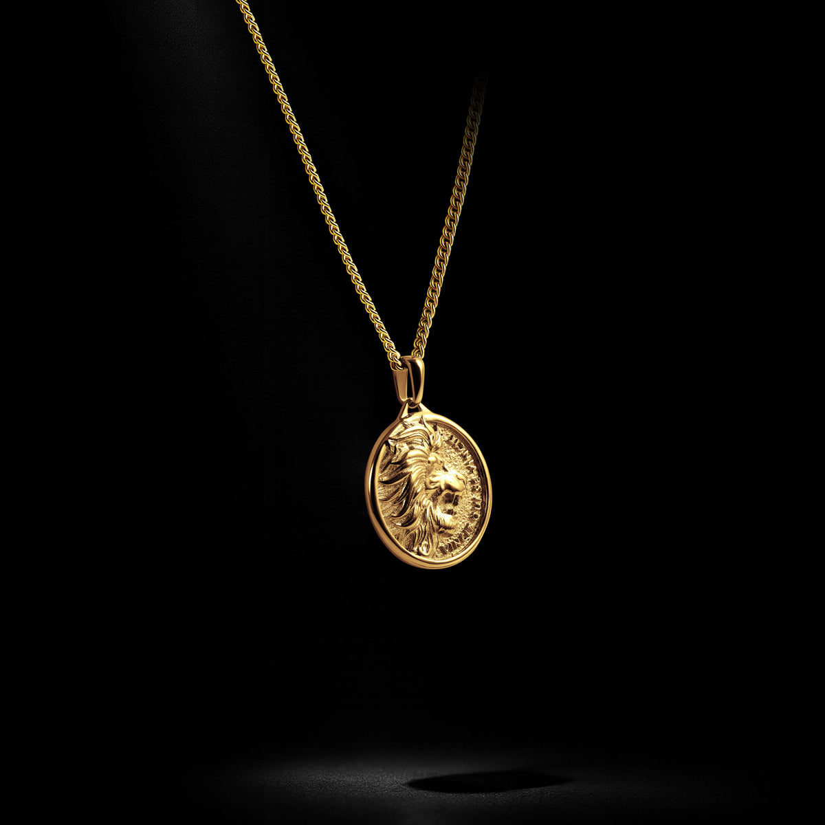 Gold necklace with a pendant on a black background