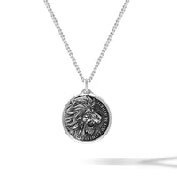 Silver necklace with a lion pendant on a white background