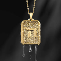 Gold pendant with a Hebrew letter on a dark background