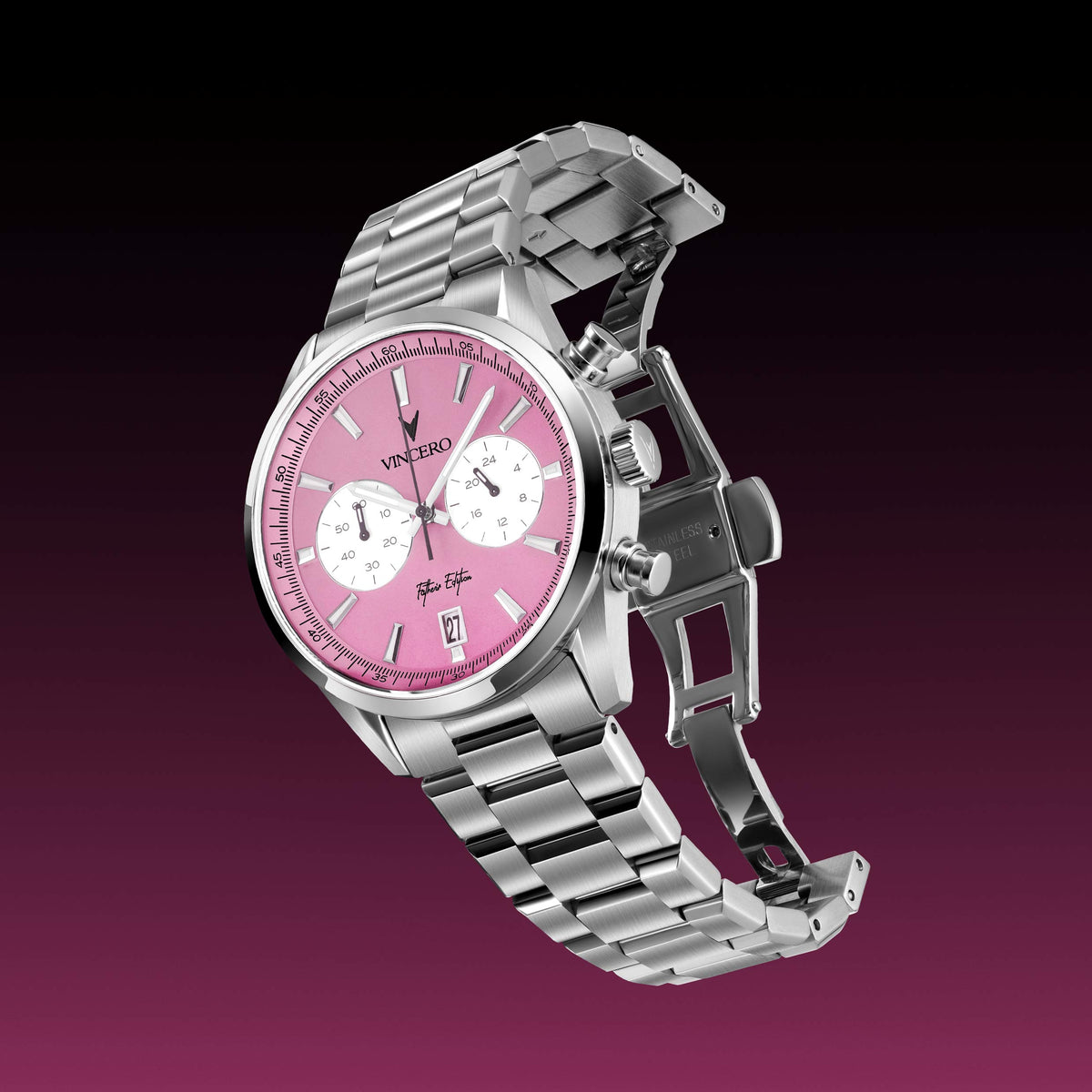 Angled profile of a Father’s Edition watch, featuring a pink face, stainless steel casing, and steel band.