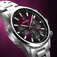 Silver wristwatch with a black face on a purple background