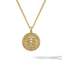 Gold necklace with a circular pendant on a white background