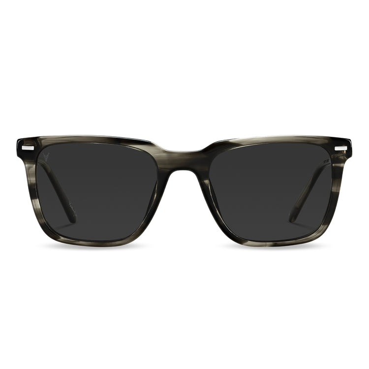 A pair of square-framed sunglasses with a smoke tint, featuring Italian marble inlay on the temples.